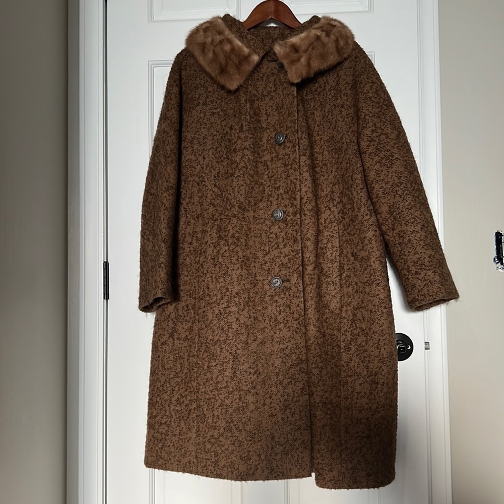 Vintage woman’s wool long coat with fur collar.